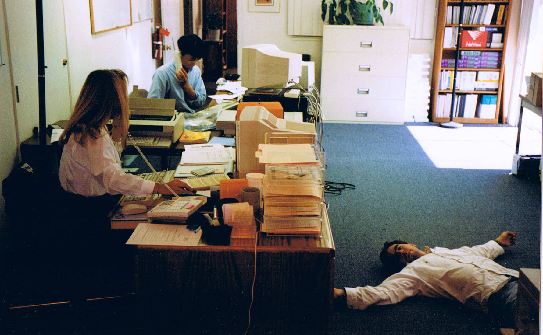 NTI offices c. 1995<br />Susan and Johnson on the phone. John after a long night.
