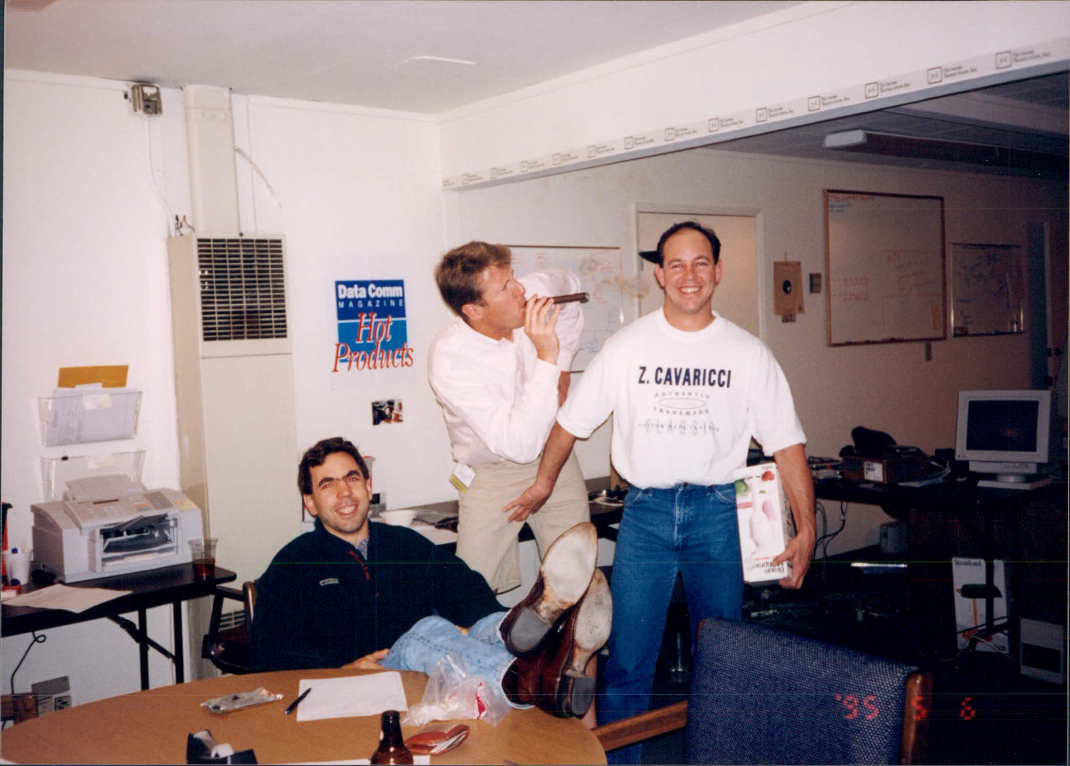 Black and White Ball night at NTI c. 1994<br />(l to r) John Mayes, Richard Clark, Tom Dwyer<br />Note Data Communications Hot Product award on wall<br /><br />Photo by un